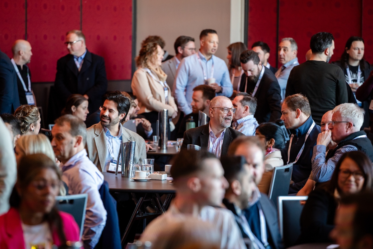 B2B eCommerce professionals at a B2BEA networking event discussing digital transformation