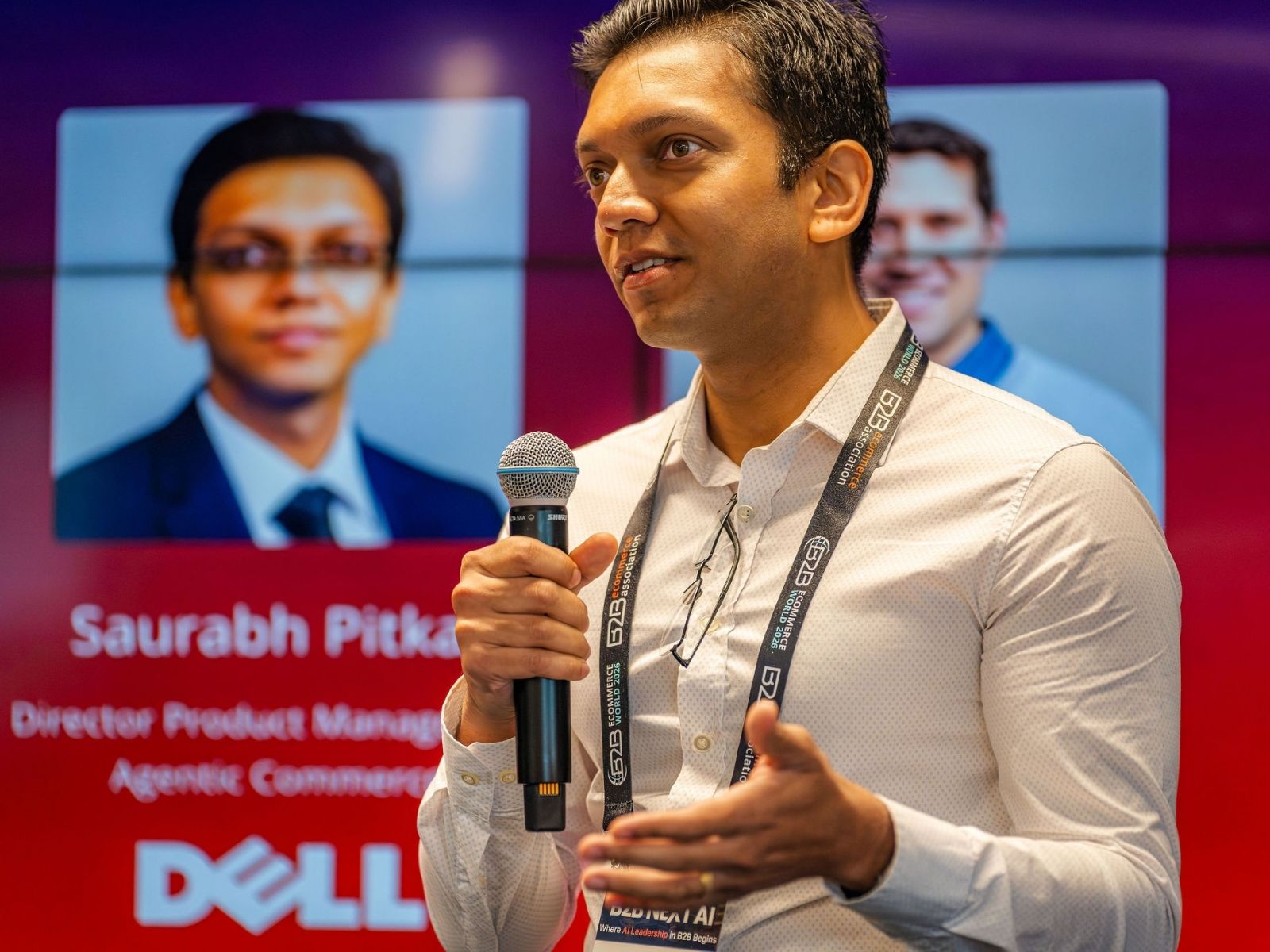 Speaker with microphone presenting at a B2B eCommerce Association AI event